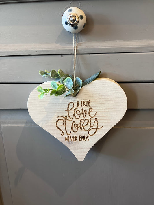 “A True Love Story Never Ends” Hanging Wooden Plaque